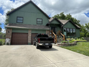 exterior of house painted with fresh green paint