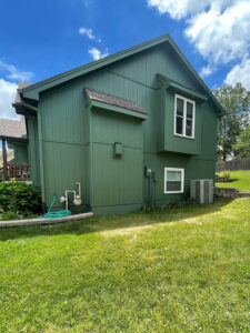 exterior of house painted with fresh green paint