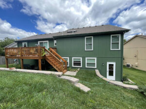 exterior of house painted with fresh green paint